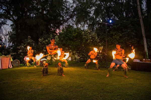 Genuine Hawaiian entertainment group performing fire knife dancing at an event | Altus Entertainment