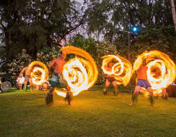 Hawaiian entertainment for parties performing fire knife dancing at a private event | Altus Entertainment
