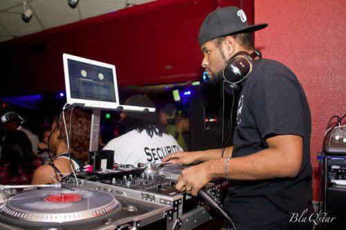 Picture taken from behind DJ Washington DC performing while guests dance in front of him at private party | Altus Entertainment