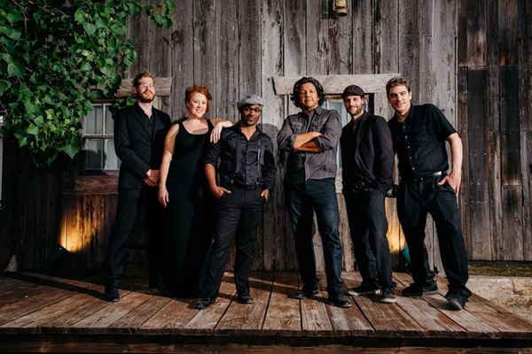 Texas variety cover band wearing color coordinated outfits while leaning against one another for promotional photoshoot | Altus Entertainment