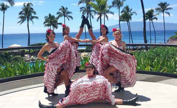 Group of female cabaret dancers for French cabaret show posing in matching costuming prior to outdoor performance | Altus Entertainment