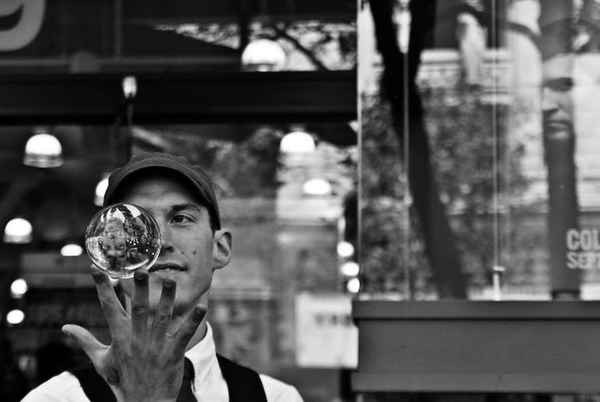 Washington contact juggler for hire juggling a single crystal ball during a performance at an event | Altus Entertainment