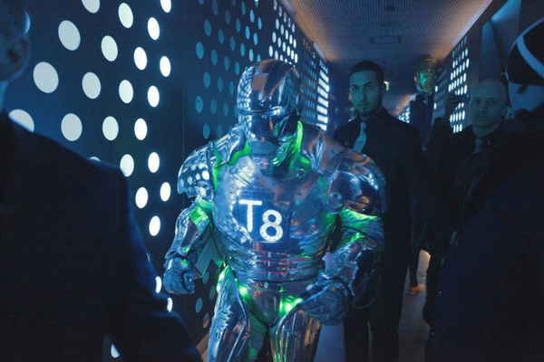 Robot performer in robot laser show in Malta being escorted by security guards to performance area prior to show | Altus Entertainment