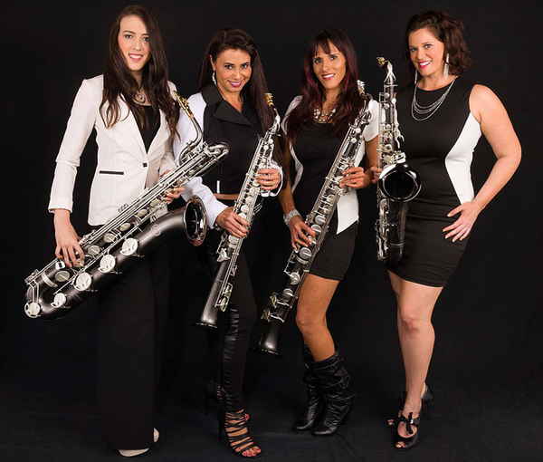 Promotional photo of all female horn musicians wearing color coordinated black and white dresses striking different poses | Altus Entertainment
