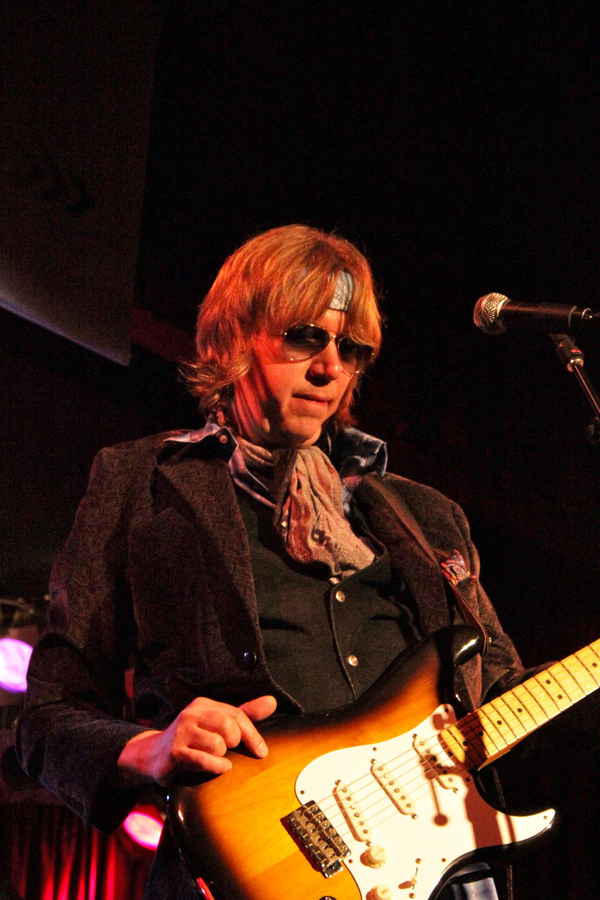 A man performing electric guitar for entertainment. | Altus Entertainment